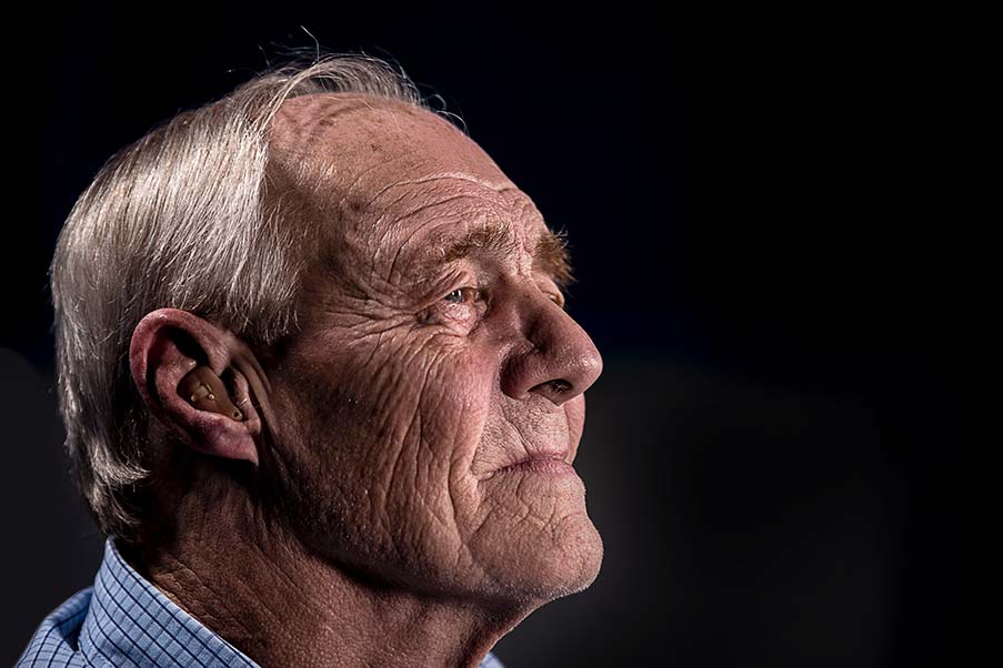 Older man wearing hearing aid