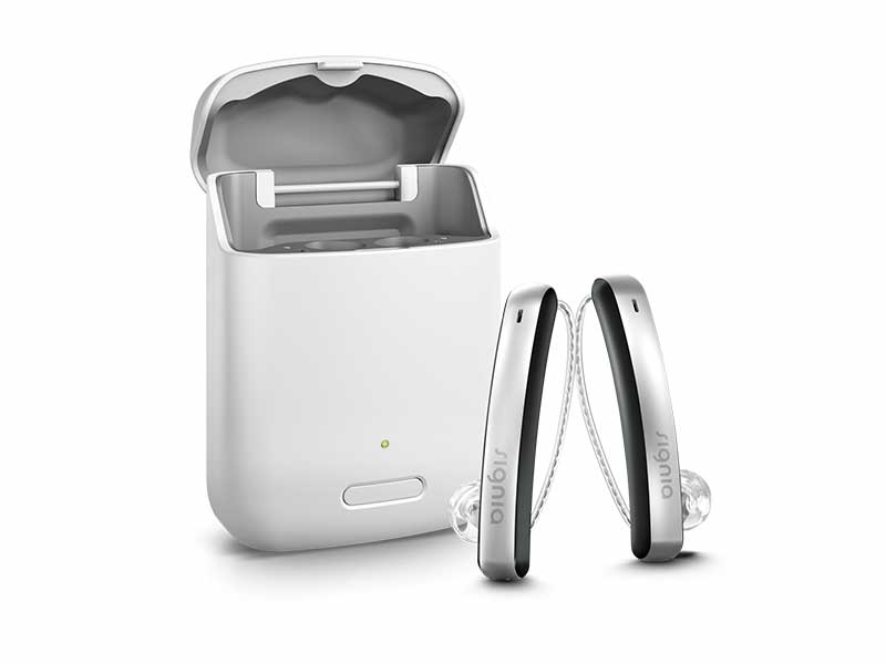 Styletto Connect hearing aids beside charger